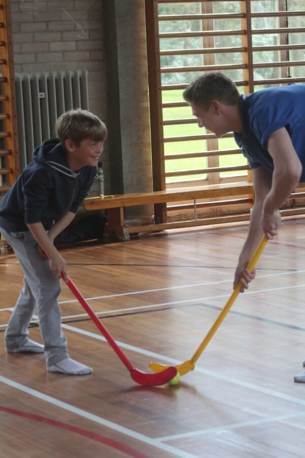 children play hockey